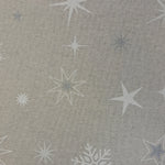 White and Silver stars and snowflakes over a neutral background.   A printed half panama European produced fabric, it is Cotton Rich and is also referred to as a canvas by some. Widely used for Bag Making, Apparel and Crafting. Available in half metre increments at Fabric Focus.