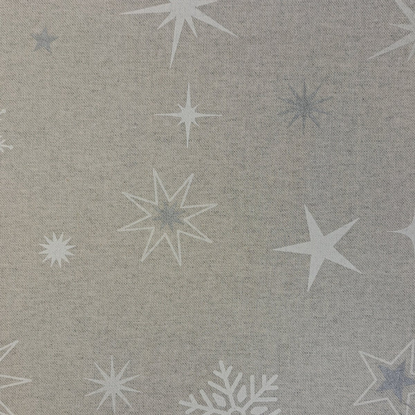 White and Silver stars and snowflakes over a neutral background.   A printed half panama European produced fabric, it is Cotton Rich and is also referred to as a canvas by some. Widely used for Bag Making, Apparel and Crafting. Available in half metre increments at Fabric Focus.