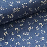 Light weight cotton chambray with a white line design in a scattered daisy motif. Classic White on a denim/sky colour way for that nautical look, ideal for summer shirts, tops and dresses. Perfect holiday classic. Sold in half metre increments at Fabric Focus.