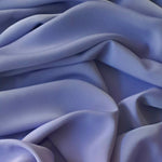 Beautiful self coloured crepe in soft lavender with great drape.  Suitable for day and evening wear alike. 100% Polyester. Sold in half meter lengths at Fabric Focus