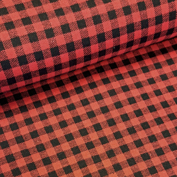 A cosy warm brushed flannel cotton weave in black and red squares that make up into a mini Buffalo Plaid check. Great to make into oversized boyfriend shirts, or cozy pyjamas! Available to buy in half metre increments at Fabric Focus Edinburgh.