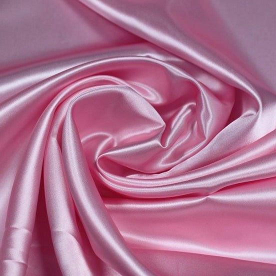 A great satin for evening wear or as a luxurious lining to a coat or jacket. Comes in various beautiful shades. This being the pale pink. Dry Clean Only NOTE - This fabric will mark if in contact with water Use a dry iron when pressing Available to buy online in half metre increments at Fabric Focus Edinburgh.
