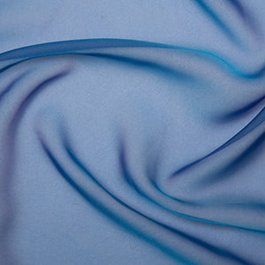 Cationic chiffon is beautifully soft and flowing fabric. Many of the colours in this range have a two tone weave which show different shades when viewed at different angles. Cationic Chiffon drapes beautifully and is used in bridal and evening designs. Available to buy in half metre increments.