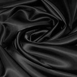 A great satin for evening wear or as a luxurious lining to a coat or jacket. Comes in various beautiful shades. This being the classic black. Dry Clean Only NOTE - This fabric will mark if in contact with water Use a dry iron when pressing Available to buy online in half metre increments at Fabric Focus Edinburgh.