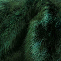 Luxury faux fur in a long hair pile, Dark green with black tips. Available in store and online at Fabric Focus Edinburgh