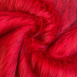 Super luxurious long hair fur in scarlet red with black tips. Available in store and online at Fabric Focus Edinburgh.