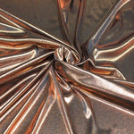 metallic lame. bronze on black. 100% polyester. Fabric Focus