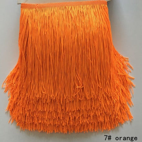 polyester fringing in bright orange colourway. Available to buy in store and online at Fabric Focus Edinburgh.