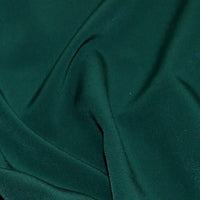 Polyester Luxury Crepe in Bottle green. Available to order in store and online at Fabric Focus Edinburgh.