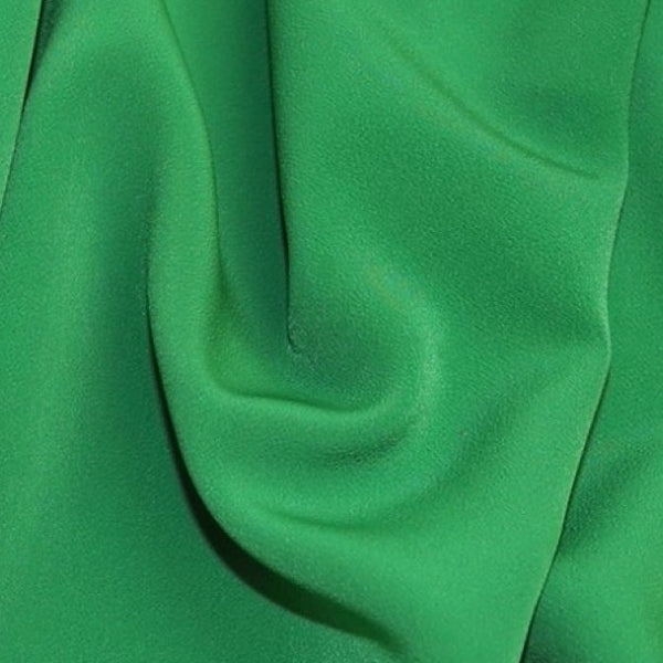 Luxury polyester crepe in emerald green available to order online and in store at Fabric Focus Edinburgh.