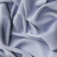 Prestige a polyester crepe in dusty blue colourway. Available to buy in store and online at Fabric Focus Edinburgh.