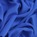 Polyester matte crepe in royal blue called Prestige. Available to buy in store and online at Fabric Focus Edinburgh.