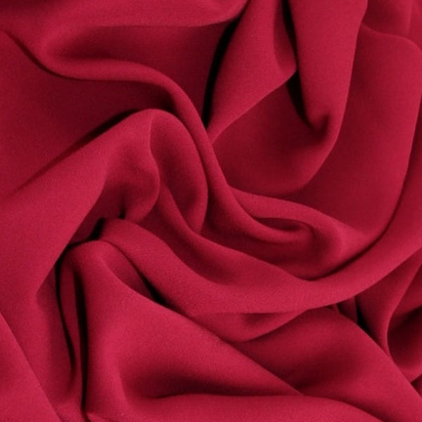 Prestige polyester crepe in wine colourway. Available to buy in store and online at Fabric Focus Edinburgh.