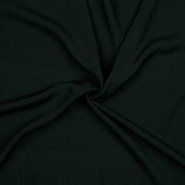 A beautiful plain viscose fabric in a stunning classic black colour. perfect for wrap dresses, wide legged trousers and blouses. Mix with printed viscose for a great summer ensemble. Available to buy in half metre increments at Fabric Focus.