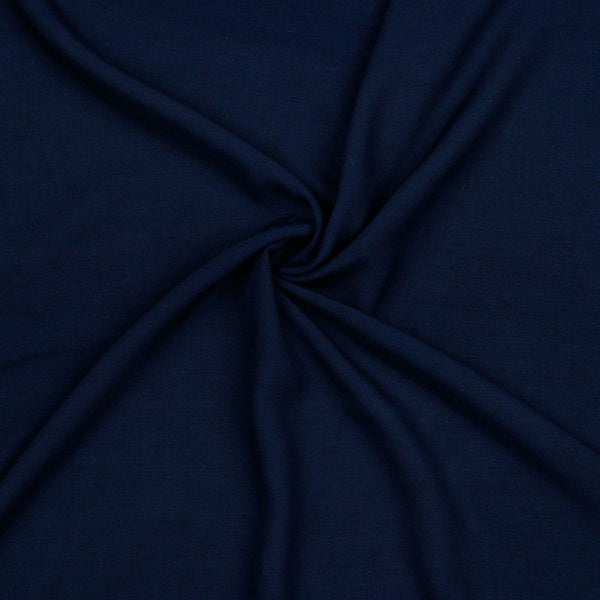 A beautiful plain viscose fabric in a stunning classic navy colour. perfect for wrap dresses, wide legged trousers and blouses. Mix with printed viscose for a great summer ensemble. Available to buy in half metre increments at Fabric Focus.