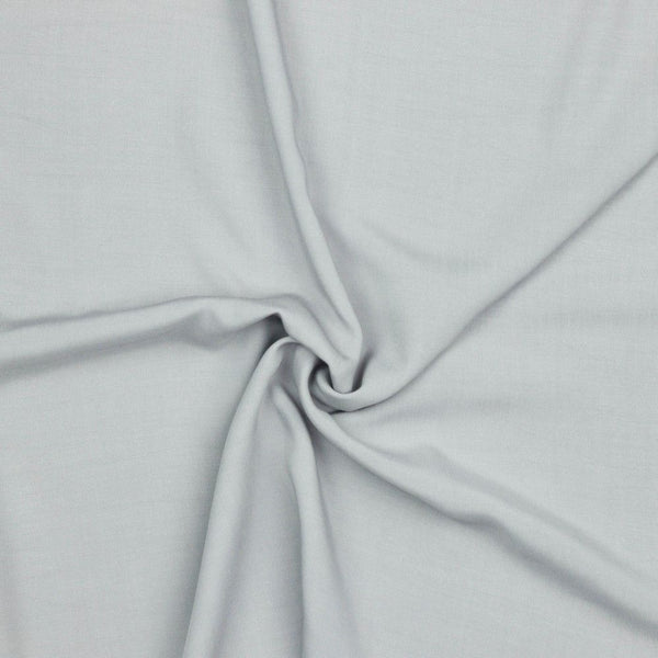 A beautiful plain viscose fabric in a stunning classic grey colour. perfect for wrap dresses, wide legged trousers and blouses. Mix with printed viscose for a great summer ensemble. Available to buy in half metre increments at Fabric Focus.