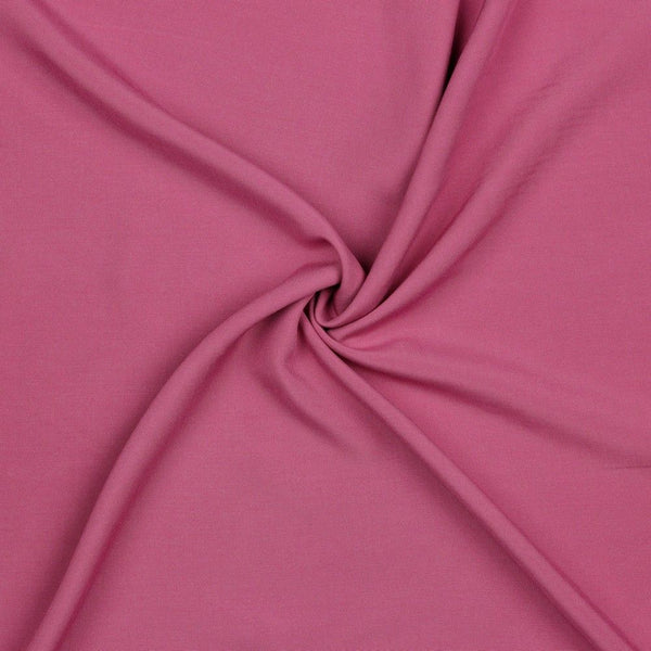 A beautiful plain viscose fabric in a stunning fashionable mauve colour. perfect for wrap dresses, wide legged trousers and blouses. Mix with printed viscose for a great summer ensemble. Available to buy in half metre increments at Fabric Focus.