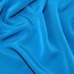 Luxury crepe in peacock colourway. 100% polyester, Available to buy online or in store at fabric Focus Edinburgh
