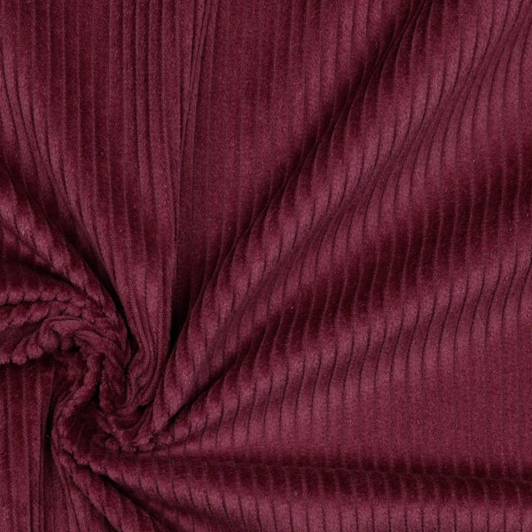 Lustrous and soft, Corduroy is also extremely durable and can be used in dressmaking, for soft furnishings and toys and even for upholstery. This is approximately a 4.5 wale. And comes in many wearable colours, this being a rich Berry. Available to buy online in half metre increments.